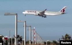 FILE - A Qatar Airways plane is seen in Doha, Qatar, June 5, 2017.