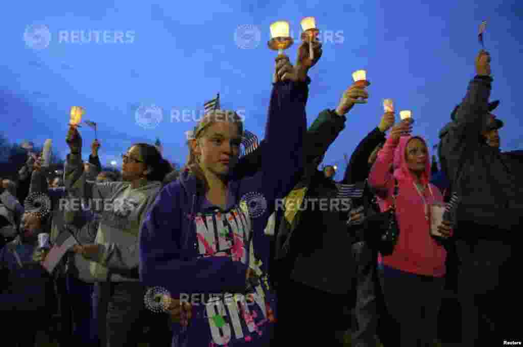 Local residents attend a candlelight vigil in the Dorchester neighborhood of Boston, Massachusetts, April 16, 2013, where eight-year-old victim Martin Richard lived. 