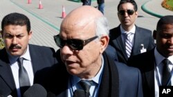 Mohammed Chouaib, head of delegation from the UN-recognized government in the eastern city of Tobruk, speaks to the media as he arrives at the Palais des Congres of Skhirate 30 km south of Rabat, March 20, 2015.