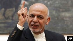 FILE - Afghan President Ashraf Ghani speaks during a press conference at the presidential palace in Kabul, Afghanistan, July 15, 2018. 
