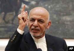 FILE - Afghan President Ashraf Ghani speaks during a press conference at the presidential palace in Kabul, Afghanistan, July 15, 2018.