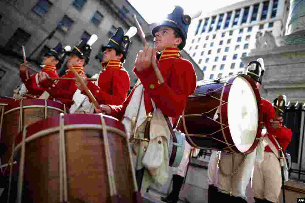 Members of the The Fort McHenry Guard Field Musicians perform at the base of the Battle Monument during the Star Spangled Spectacular in Baltimore, Maryland. Celebrating the 200th anniversary of the U.S. national anthem, Baltimore&#39;s Inner Harbor is hosting tall ships, fireworks displays, concerts, historic tours and other events.