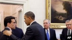 President Barack Obama talks with Rep. Eric Cantor, R-Va., at the conclusion of a meeting with bipartisan Congressional leadership in the Oval Office Private Dining Room, Nov. 30, 2010. Listening at right are: Sen. Mitch McConnell, R-Ky.; Sen. Jon Kyl, R-