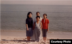 FILE - Kim Jong Nam, front row center, at Wonsan Beach in 1980. Rear row left to right, aunt Sung Hye Rang, maternal grandmother Kim Won Ju, Ri Nam Ok. (Source: Imogen O’Neil/The Golden Cage: Life with Kim Jong Il, A Daughter’s Story.)