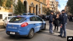 Italian police stand by an evacuated school after four earthquakes hit central Italy in the space of an hour, shaking the same region that suffered a series of deadly quakes last year, in Rome, Jan. 18, 2017. 