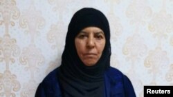 Rasmiya Awad, believed to be the sister of slain Islamic State leader Abu Bakr al-Baghdadi, who was captured on Monday in the northern Syrian town of Azaz by Turkish security officials, is seen in an unknown location in an undated picture provided by Turkish security officials. 