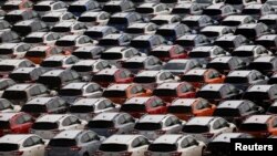 Newly manufactured cars of the automobile maker Subaru await export in a port in Yokohama, Japan May 30, 2017. 
