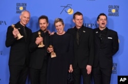 The cast and crew of "Three Billboards Outside Ebbing, Missouri," winner of three awards including best motion picture - drama, at the 75th annual Golden Globe Awards. (Photo by Jordan Strauss/Invision/AP)