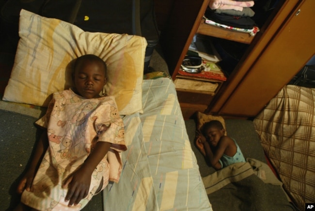 FILE - Children take an afternoon nap at an orphanage in Harare, Zimbabwe, May 26, 2006.