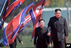 FILE - North Korean leader Kim Jong Un, right, and Choe Ryong Hae, vice-chairman of the central committee of the Workers' Party, arrive for the official opening of the Ryomyong residential area in Pyongyang, North Korea.