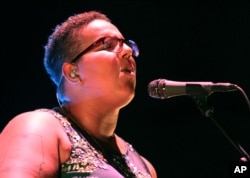 FILE - Brittany Howard with Alabama Shakes performs at Verizon Wireless Amphitheatre at Encore Park in Atlanta, Georgia, Aug. 21, 2015.