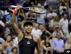 Naomi Osaka, of Japan, celebrates after defeating Madison Keys during the semifinals of the U.S. Open tennis tournament, Thursday, Sept. 6, 2018, in New York. (AP Photo/Seth Wenig)