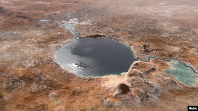 This illustration shows Jezero Crater — the landing site of the Mars 2020 Perseverance rover — as it may have looked billions of years go on Mars, when it was a lake. An inlet and outlet are also visible on either side of the lake. (Image Credit: NASA/JPL-Caltech)
