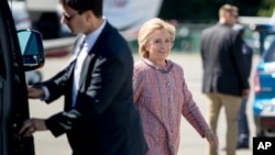 Democratic presidential candidate Hillary Clinton arrives to board her campaign plane at Westchester County Airport, in White Plains, Sept. 15, 2016, to travel to Greensboro, N.C. for a rally. 