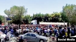 In this image shared on social media, hundreds of Iranians march in the central city of Isfahan’s New Shapur district, July 31, 2018, to denounce the government’s handling of the rial’s recent slump to record lows against the dollar.