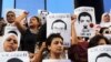 FILE - Protesters rally in support of three detained Al Jazeera journalists in front of the Press Syndicate in Cairo, Egypt, June 1, 2014.