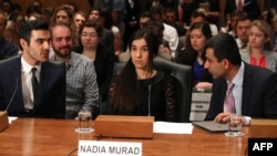 Nadia Murad, (C), human rights activist, testifies during Senate Homeland Security and Governmental Affairs Committee hearing on Capitol Hill in Washington, June 21, 2016. 