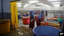 FILE - A government raid empties a shrimp shed in Samut Sakhon, Thailand, Nov. 9, 2015. Slavery has often been considered an acceptable business practice in the country's seafood export capital.