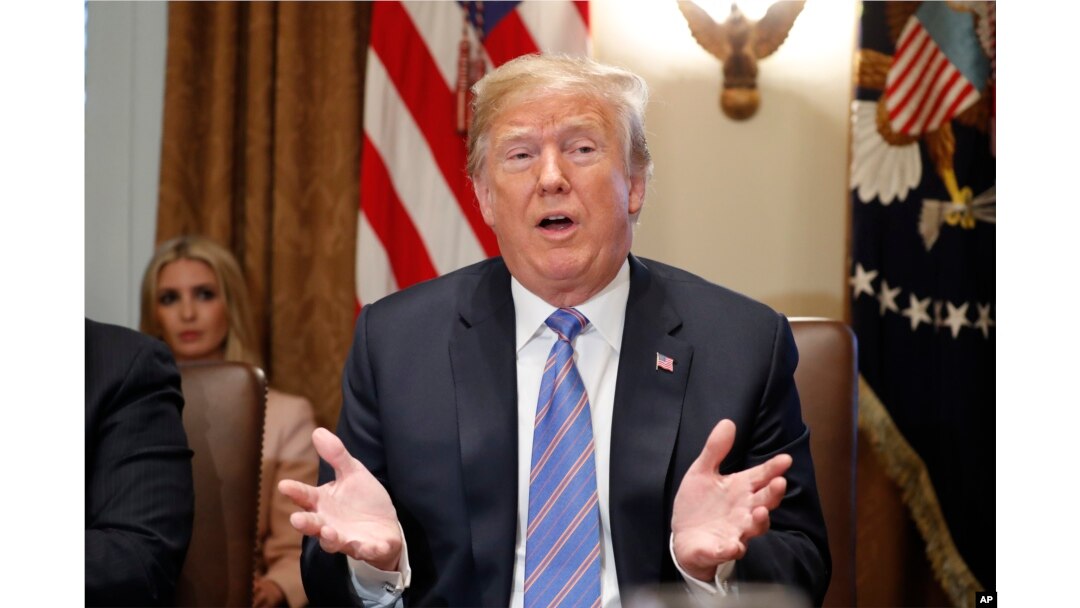 President Donald Trump speaks during his meeting with members of his cabinet in Cabinet Room of the White House in Washington, July 18, 2018.