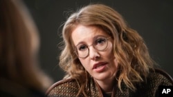 FILE - Russian celebrity TV host Ksenia Sobchak, who is challenging Russian President Vladimir Putin in the March 18 presidential election, speaks during an interview with the Associated Press in Moscow, Feb. 1, 2018. 