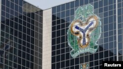 FILE - The Central Bank of Nigeria's logo is seen on the headquarters in Abuja, Jan. 22, 2018.