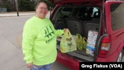 Elleen McLaughlin, who works in a nursing home, supplements the food she grows in rural west-central Illinois with what she can buy at places like the Dollar Store.