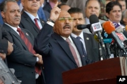 FILE - Former Yemeni President Ali Abdullah Saleh speaks during a ceremony to celebrate the 35th anniversary of the founding of the Popular Conference Party, in Sanaa, Yemen.