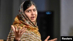FILE - Malala Yousafzai of Pakistan speaks at the World's Children's Prize ceremony in Mariefred, Sweden, Oct. 29, 2014.