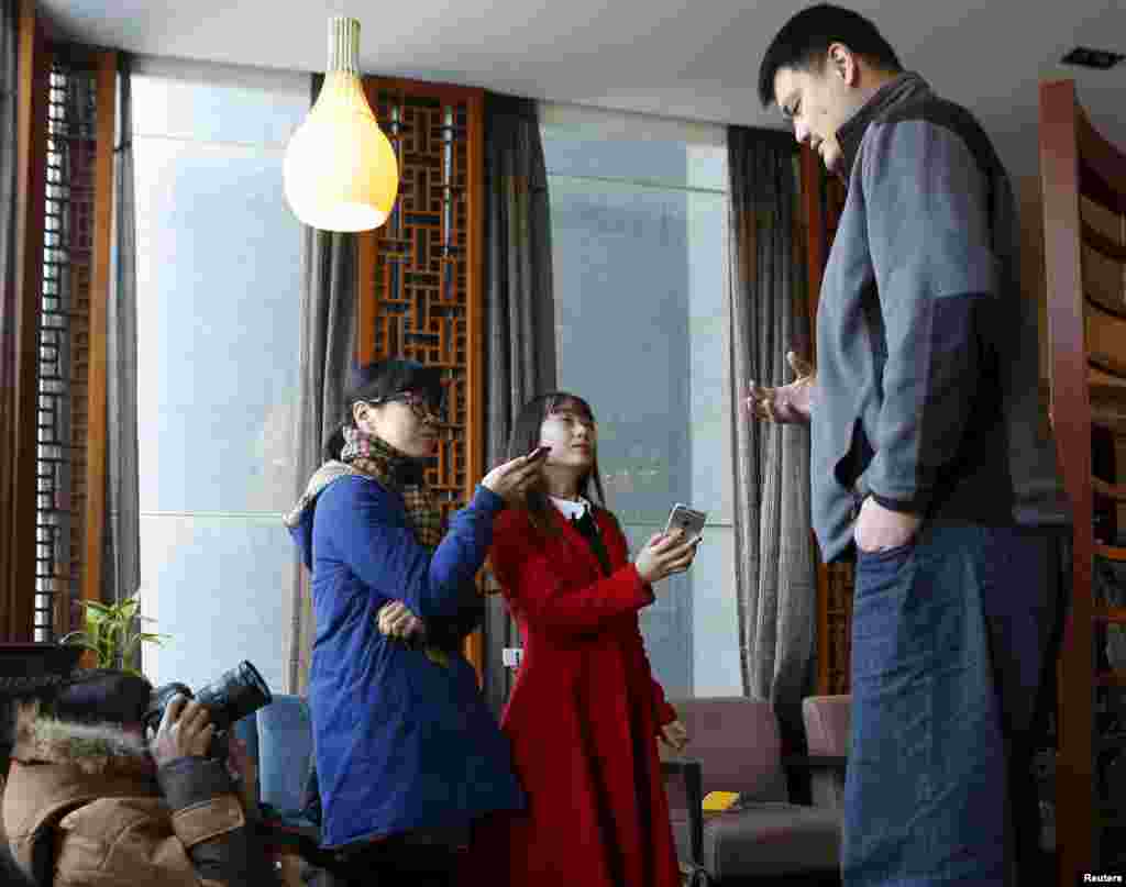 Former NBA player Yao Ming (R), a member of the 12th Chinese People's Political Consultative Conference (CPPCC) National Committee, is seen during an interview in Beijing, China, in this picture taken March 9, 2016.