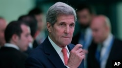 FILE - U.S. Secretary of State John Kerry arrives to address the media during a news conference on the sidelines of the of NATO foreign ministers conference in Antalya, Turkey, May 13, 2015. 