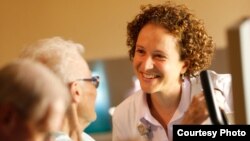 Ilhem Messaoudi, Associate Professor of Biomedical Sciences in the U.C. Riverside School of Medicine, talks with patients. (L. Duka.)