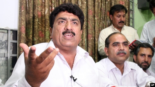 FILE - Jamil Afridi (left) brother of a Pakistani doctor Shakil Afridi, holds a a news conference in Peshawar, Pakistan, May 28, 2012.