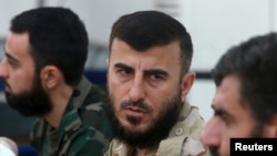 FILE - Zahran Alloush, founder of the Army of Islam, talks during a conference in Douma, Syria, Aug. 27, 2014. Alloush was killed Friday in a Russian airstrike on the his group's headquarters in Eastern Ghouta.