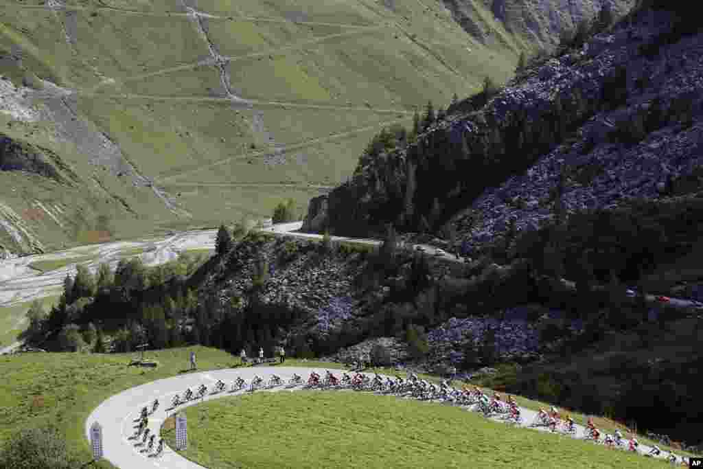 Cyclists climb Cormet de Roselend during the stage 18 of the Tour de France cycling race over 175 kilometers (108.7 miles) from Meribel to La Roche-sur-Foron, France.