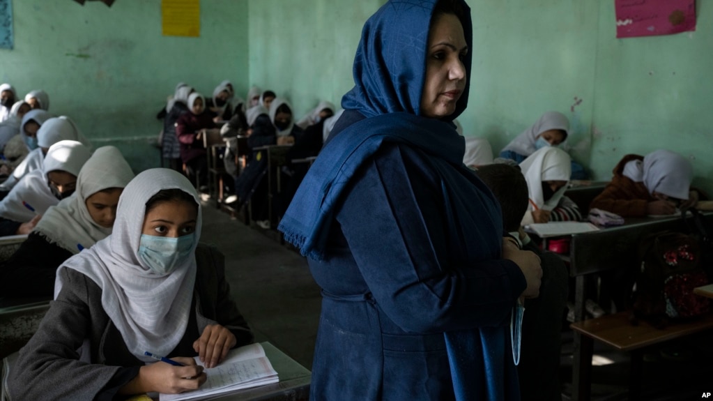 Afghan girls listen their teacher at Tajrobawai Girls High School, in Herat, Afghanistan, Thursday, Nov. 25, 2021. (AP Photo/Petros Giannakouris)