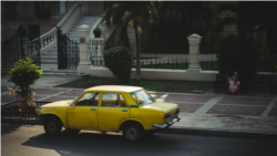 Old Yellow Car Parked on the Street