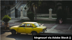 Old Yellow Car Parked on the Street