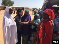 U.S. Deputy UN Ambassador Michelle Sison talks to women in the Maiduguri camp. (M.Besheer/VOA)