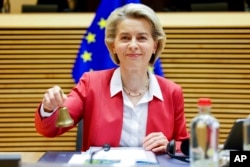 President of the European Commission Ursula von der Leyen rings the bell at the beginning of the College of Commissioners in Brussels, Dec 1, 2021.