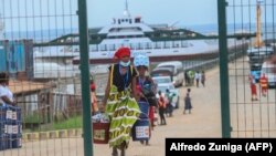 FILE - Internally displaced people arrive in Pemba, Mozambique on April 1, 2021.