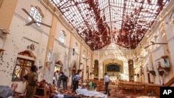 Dead bodies of victims lie inside St. Sebastian's Church damaged in blast in Negombo, north of Colombo, Sri Lanka. April 21, 2019) 