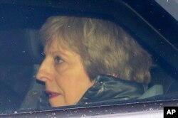 Britain's Prime Minister Theresa May arrives at the Houses of Parliament in London, March 12, 2019.