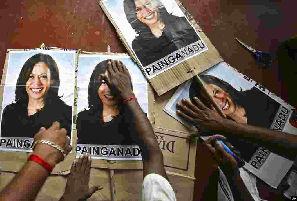 Villagers post placards featuring U.S. democratic vice presidential candidate Sen. Kamala Harris, should the Democratic Party win the presidential elections, in Painganadu, south of Chennai, Tamil Nadu state, India.