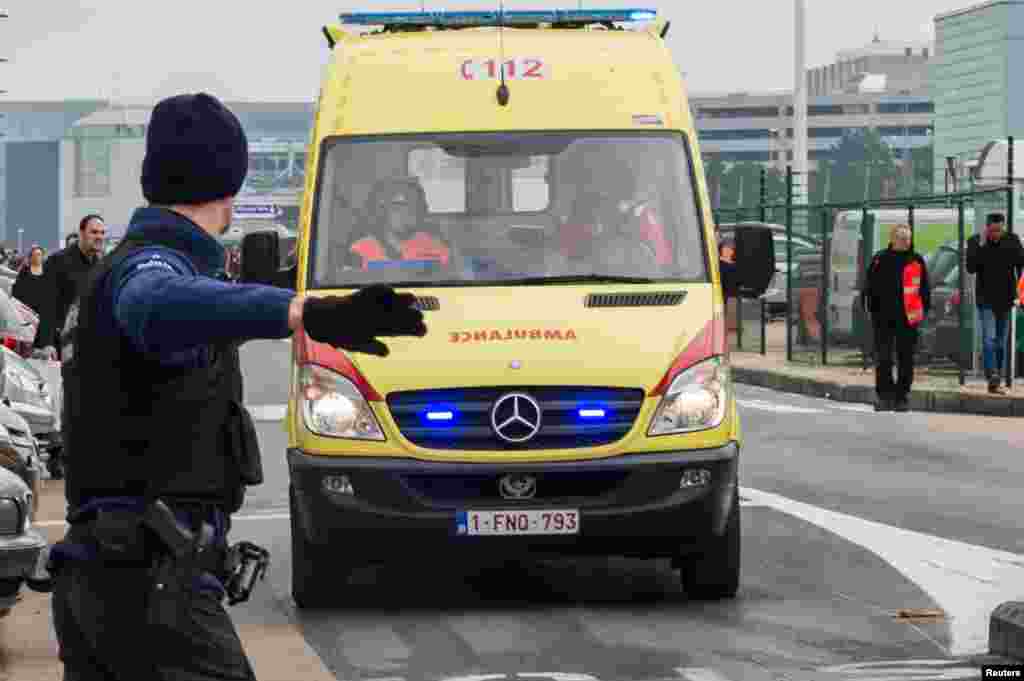 Ambulances arrive to the scene at Brussels airport, after explosions rocked the facility in Brussels, Belgium, March 22, 2016.