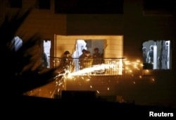 Israeli soldiers destroy the apartment of jailed Palestinian militant Maher al-Hashlamoun during a raid in the West bank city of Hebron, Oct. 20, 2015.