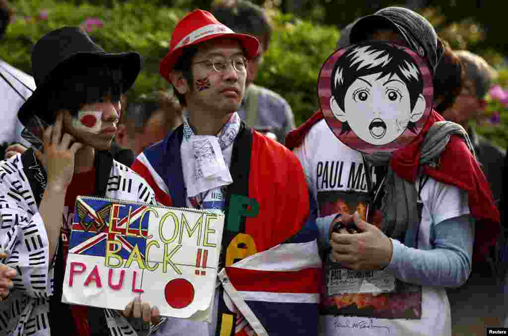 Fans wait for the arrival of Paul McCartney before his performance at the Nippon Budokan Hall in Tokyo. The concert marks McCartney&#39;s first return to the venue since he played there with the Beatles in 1966.