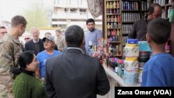 U.S. military and diplomatic delegations tour Manbij, Syria, March 22, 2018.