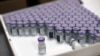 FILE - Frozen vials of the Pfizer-BioNTech COVID-19 vaccine are taken out to thaw, at the MontLegia CHC hospital in Liege, Belgium, Jan. 4, 2021. The U.S. is sending nearly 300,000 doses of the vaccine to Tajikistan.