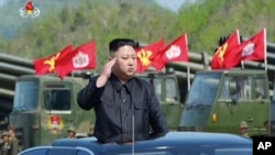 This image, from a news bulletin by North Korea's KRT, April 26, 2017, shows leader Kim Jong Un at a "Combined Fire Demonstration" held to celebrate the 85th anniversary of the North Korean army, in Wonsan, North Korea.