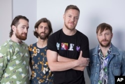 Members of Imagine Dragons, from left, Daniel Platzman, Wayne Sermon, Dan Reynolds and Ben McKee are seen in New York, June 20, 2017.